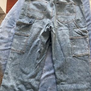 New unisex Jeans with tag. Size L/G .